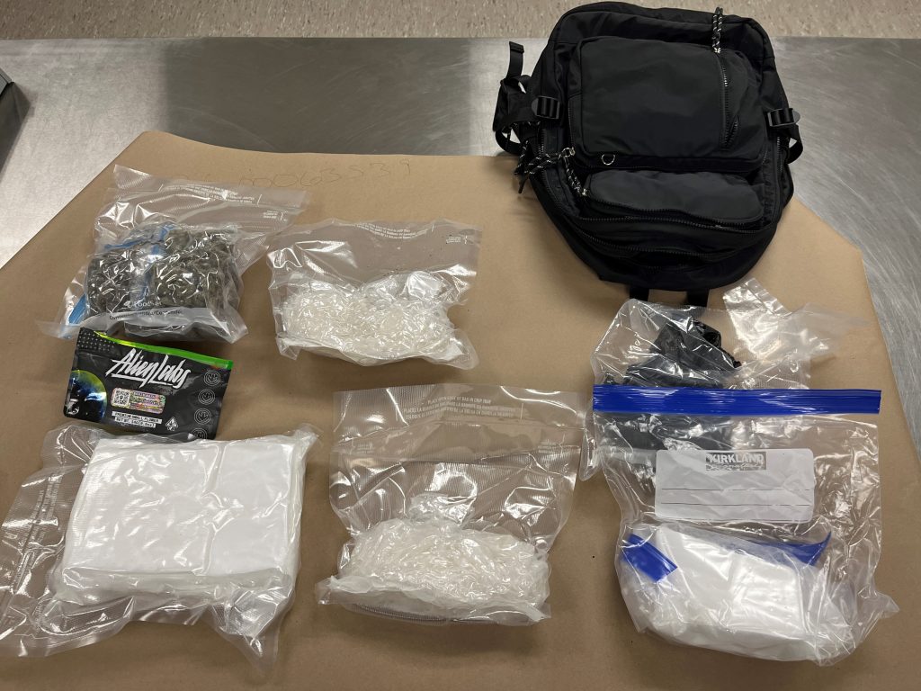 Bags of fentanyl powder, methamphetamine, cocaine, and marijuana that were seized after a vehicle pursuit and arrest in Bingham County.
